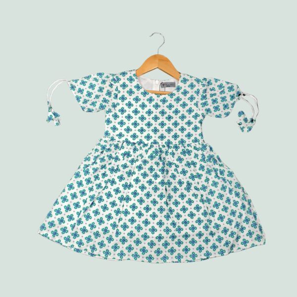 Cool, comfy, and playful – this geometric print frock is perfect for sunny days and happy twirls.